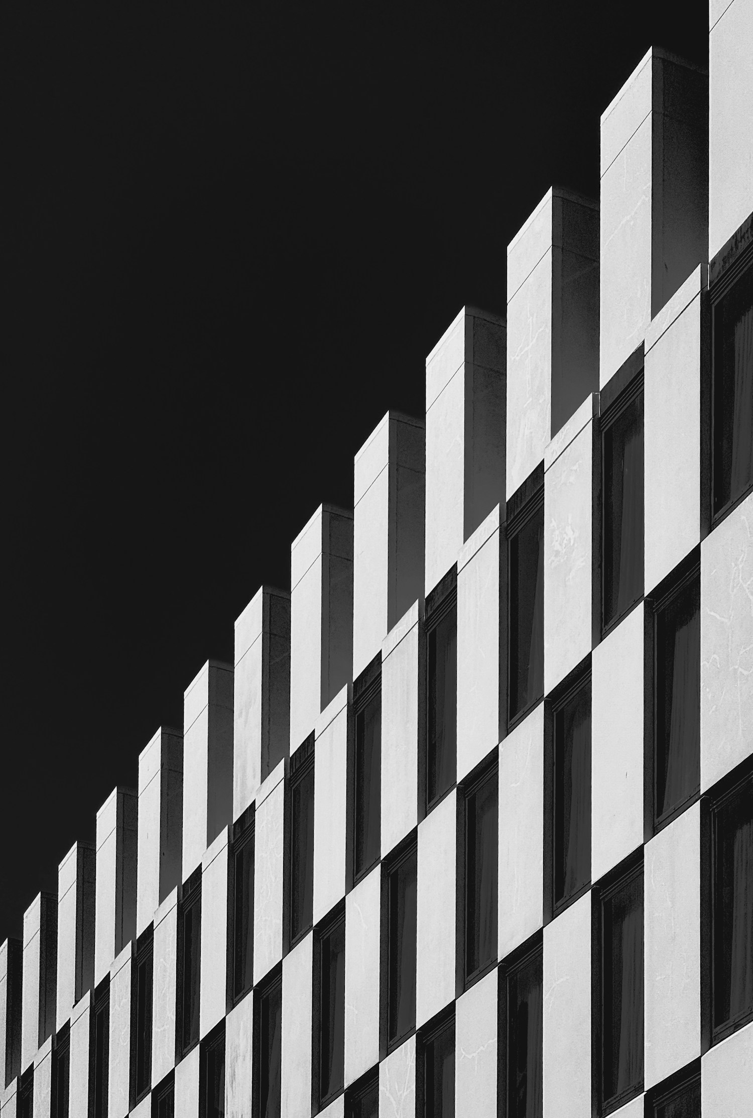Black-and-white architectural study of a stepped building facade